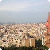 A view of the city from the sea to the mountains.  About the pinnacle, Gaudi said: "Look at the top! Is it not true that it seems to unite Heaven and Earth? This burst of mosaics is the first thing that sailors will see when approaching Barcelona - it will be a radiant welcome."