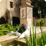 A reflecting pool and fountain in the courtyard is a picturesque, placid place to contemplate.