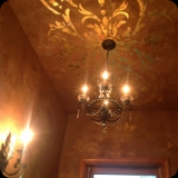 74  Exquisite powder room - Inlaid gold Lusterstone finish on walls & custom ornamental ceiling.  Coordinating etched glass motif on window.