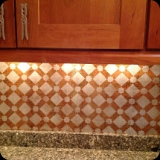 116  Detail of Moroccan Star Trellis Stenciled over Burnt Gold Pine Metallic Foil Backsplash Effect