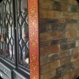 17  Faux marquetry beam accent to cap stone end wall in a kitchen