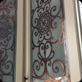 Kitchen Cabinetry Custom Glass Panels; Etched Glass with Ornamental Metallic Foil Grillwork - Installed in Heather’s c. 1814 Stone Schoolhouse & Decorative Arts Studio