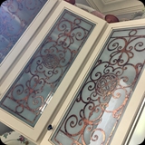 Kitchen Cabinetry Custom Glass Panels; Etched Glass with Ornamental Metallic Foil Grillwork - Installed in Heather’s c. 1814 Stone Schoolhouse & Decorative Arts Studio